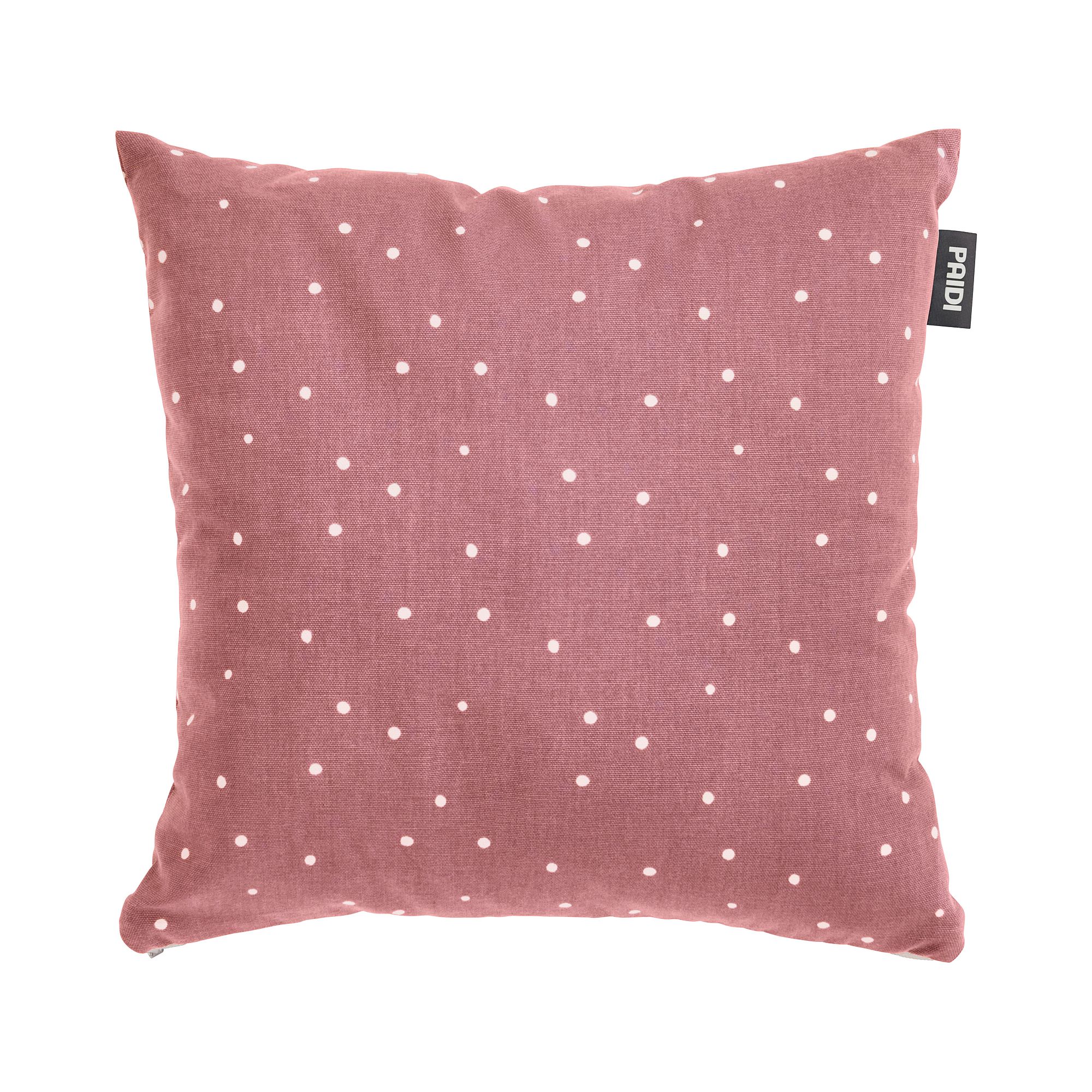 Quadratisches rosafarbenes Kissen mit weißen Tupfen und einem kleinen schwarzen Seitenanhänger.
